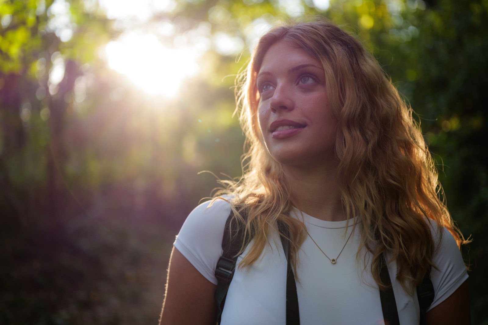 Woman hiking and feeling hopeful during substance abuse treatment in Colorado.