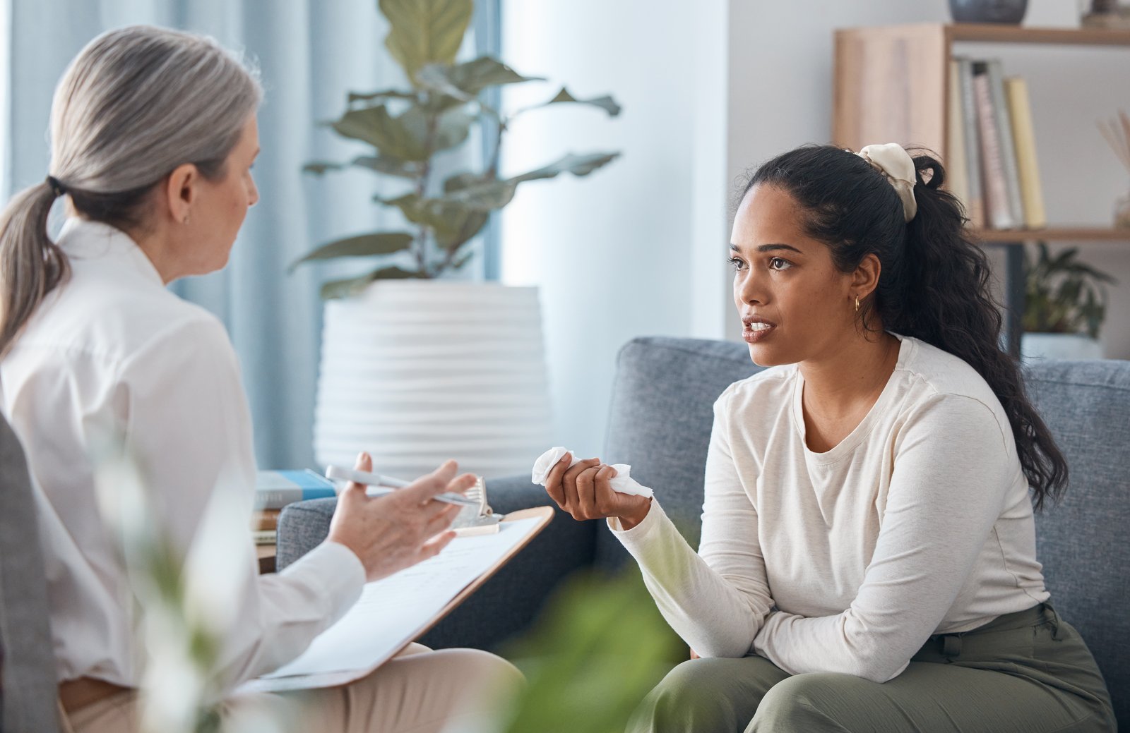 Woman in a supportive therapy session during substance abuse treatment in Colorado.